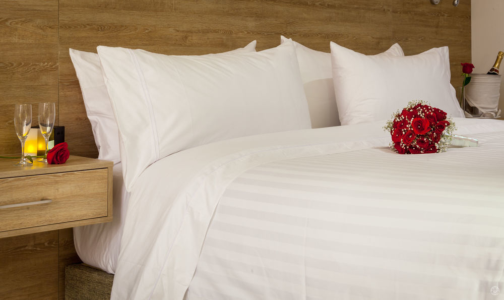 Ghl Collection Barranquilla Hotel Exterior photo A bed with white sheets